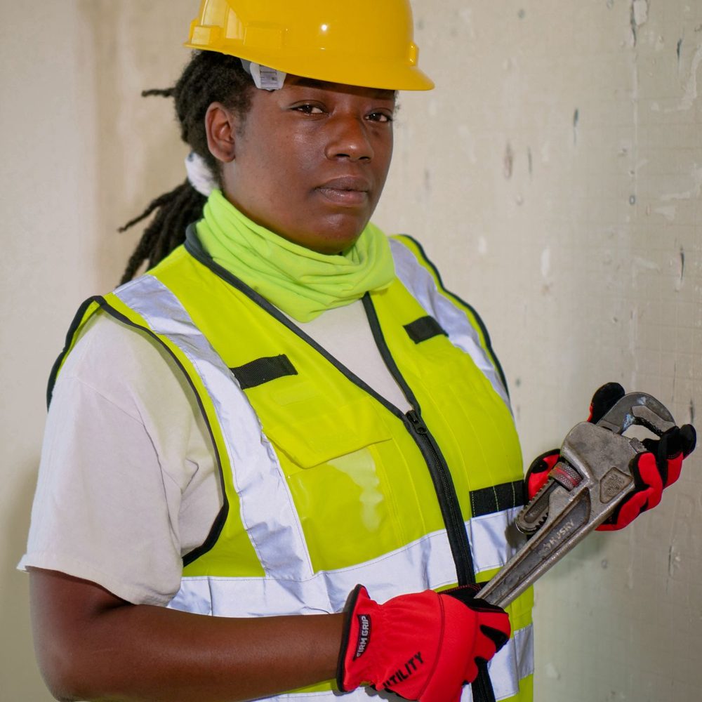 Plumber holding a pipe wrench