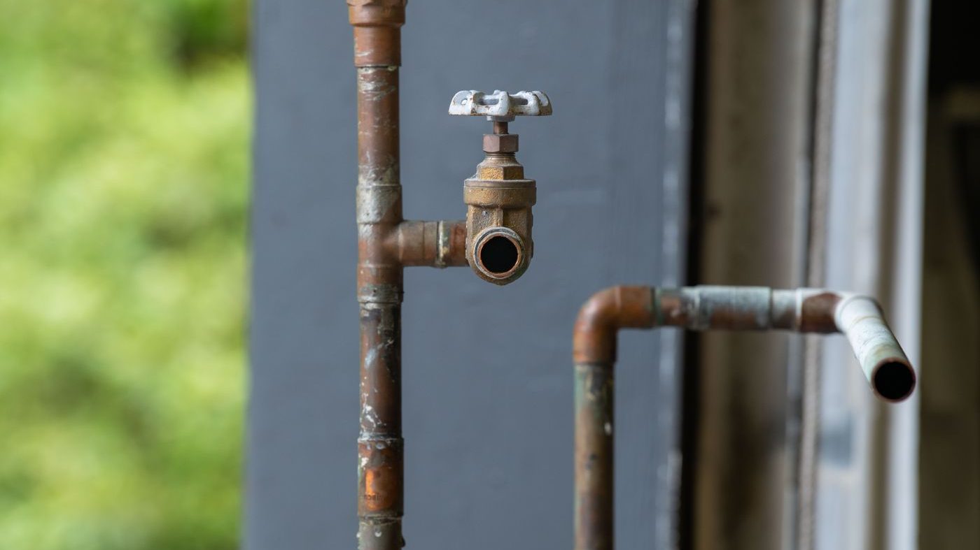 Rusty outdoor copper valve on a water service line