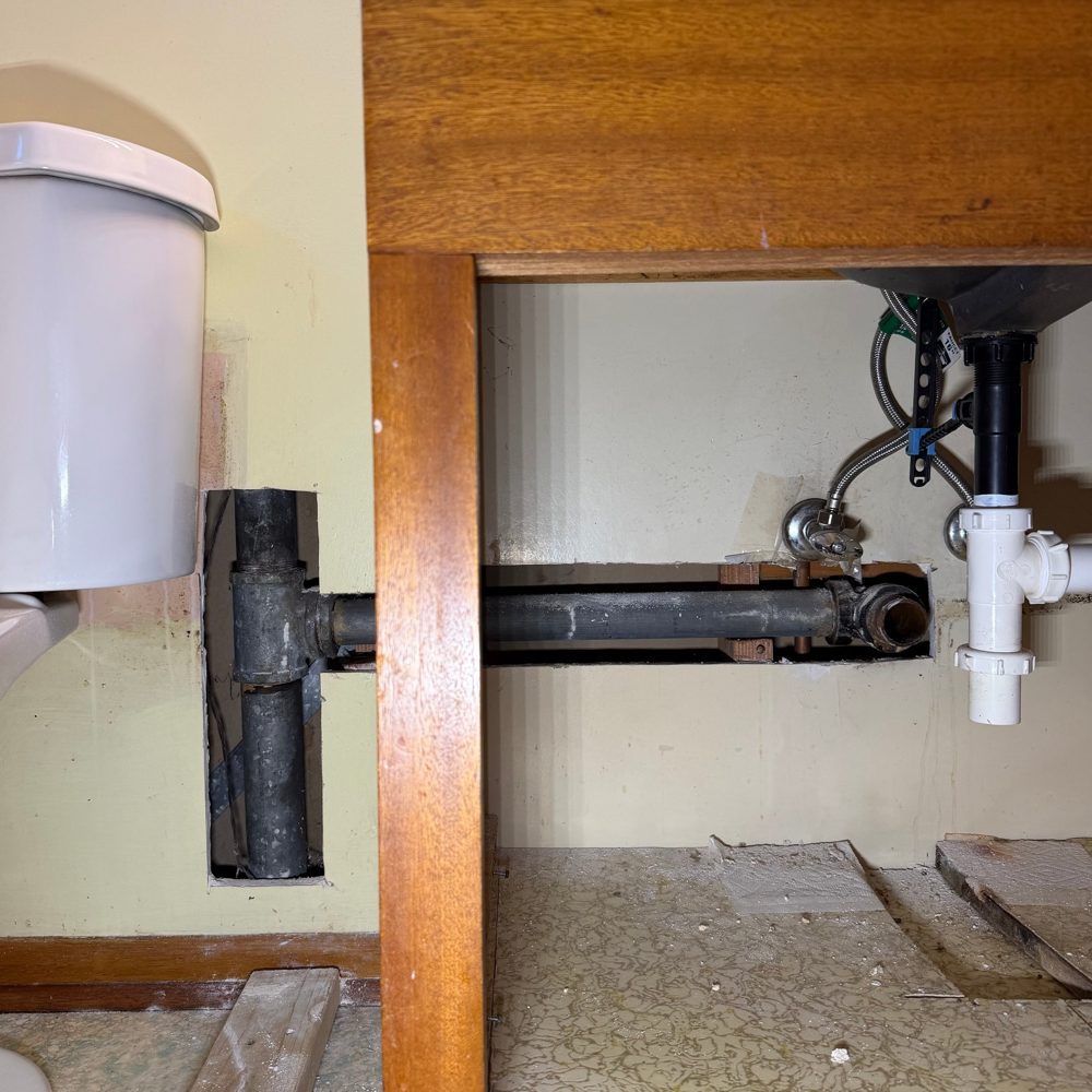 Under-sink drain taken apart during a leak and trap repair