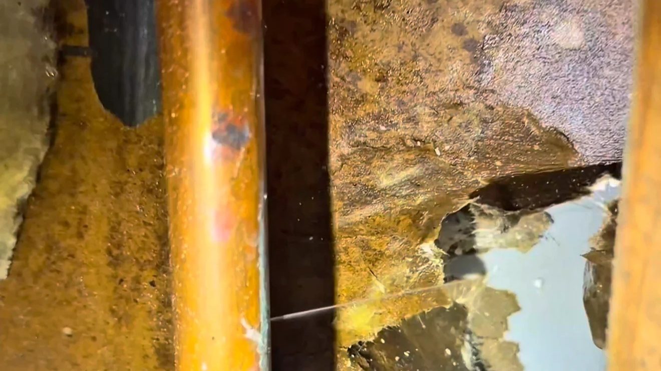 Copper pipe with wet, damaged insulation found during a leak repair